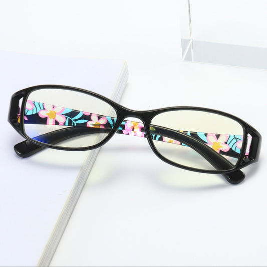 Women's lightweight fashion reading glasses with a red frame and colorful floral print temples. - Image 2