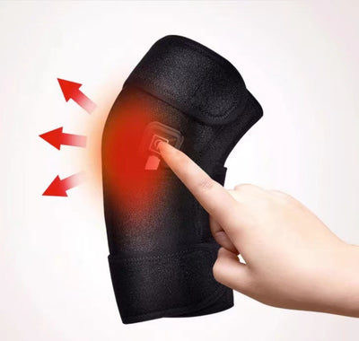 Black electric heating kneecap cover with hot compress massage, shown on a leg with a hand pressing the power button, indicating heat. - Image 9