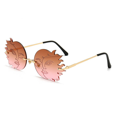 Orange sun-shaped rimless sunglasses with gold metal frames and black earpieces, featuring a smiling face design. - Image 2