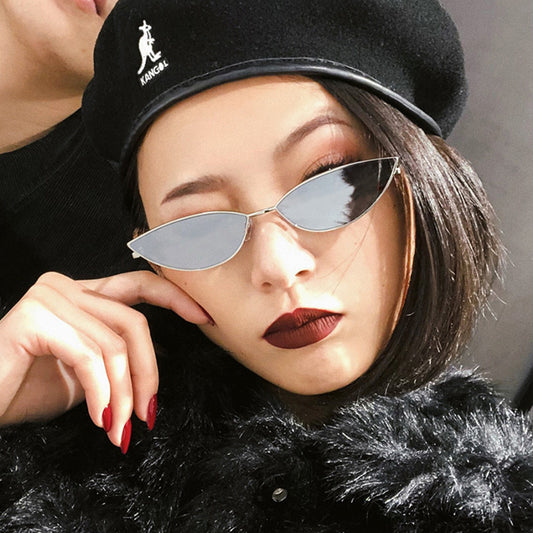 Retro cat eye sunglasses for women with bright yellow lenses and a sleek silver-tone metal frame.