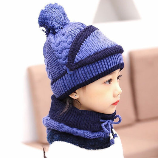 Young child wearing a pink and grey knitted hat with a pom-pom and a matching neck warmer with a drawstring. - Image 7