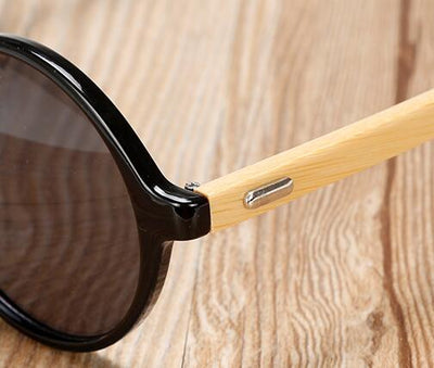 Round black frame sunglasses with gray lenses and light wood bamboo temples, shown from multiple angles. - Image 12