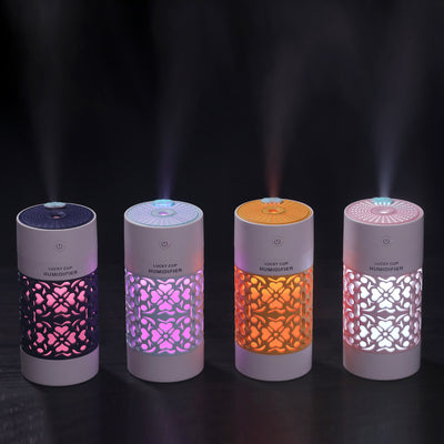 Light blue and white Lucky Cup humidifier with a decorative heart and floral cutout pattern. Features a power button. - Image 4