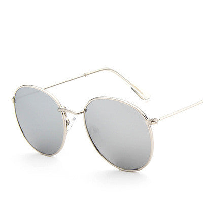 Round frame vintage sunglasses with silver metal frames and dark gray lenses on a white background. - Image 24