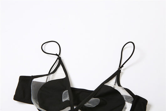 Woman wearing a white two-piece bikini with a bralette top featuring sheer cut-outs and a high-cut thong bottom with multiple straps. - Image 18