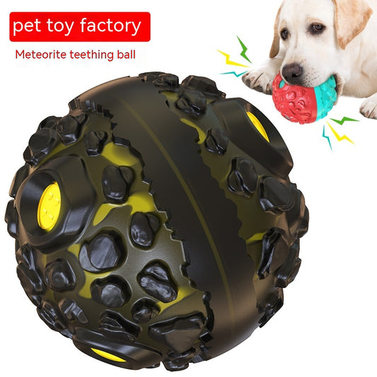 Black and yellow meteorite-shaped dog teether ball toy with textured surface and embedded yellow lights.