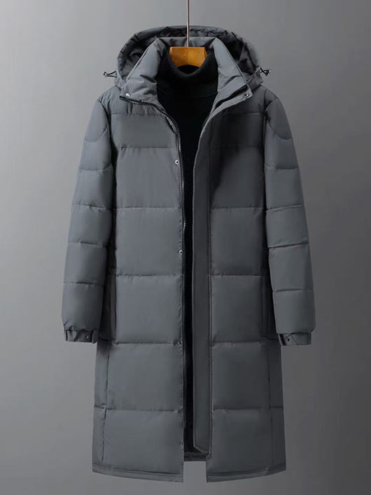 Black mid-length hooded down jacket with a quilted design, hanging on a metal rack in a store. - Image 7