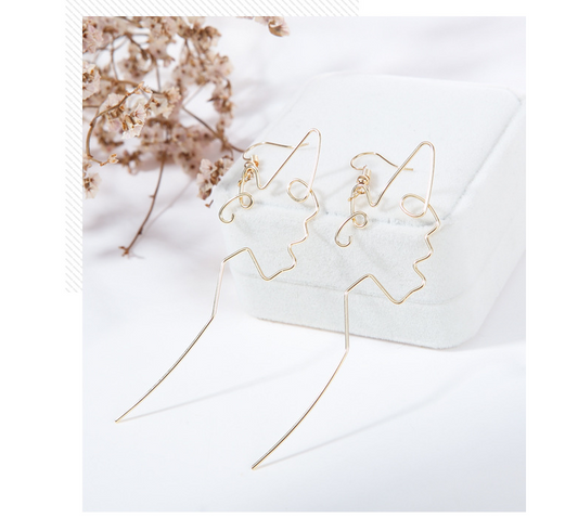 Aretes Minimalistas de Gancho Largo con Silueta Dorada - Diseño Asiático Moderno - Image 2