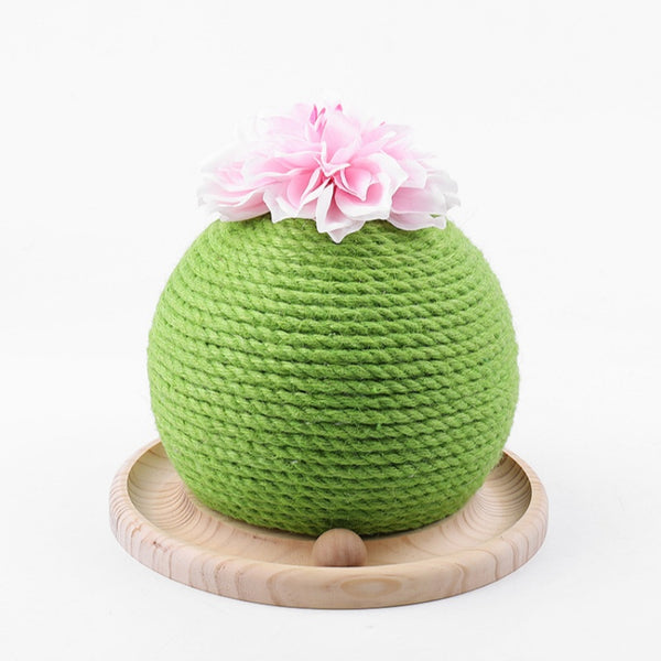 Green rope cat scratching toy shaped like a cactus with a pink flower on top, sitting on a light wood base.