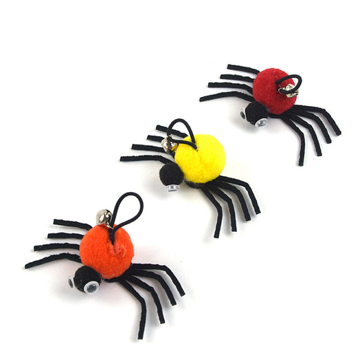 Orange and black plush spider cat toy with googly eyes and a silver bell on a white background. - Image 10