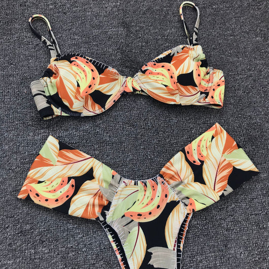 Tropical leaf print bikini with underwire gathered top and high-waisted bottoms in orange, yellow, and black. - Image 11