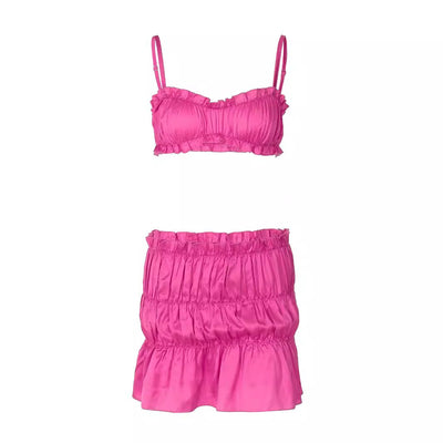 Fuchsia ruched tube top and matching pleated mini skirt set on a woman, perfect for summer. - Image 5