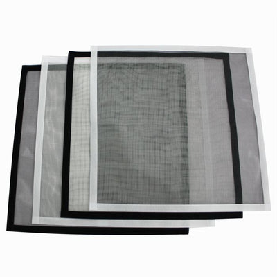 White mosquito screen applied to a window, with a hand gently pulling a corner to show its fine mesh texture. - Image 3