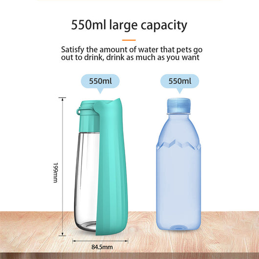 Yellow 450ml portable pet water bottle with a folding drinking trough and white wrist strap, on grass. - Image 22