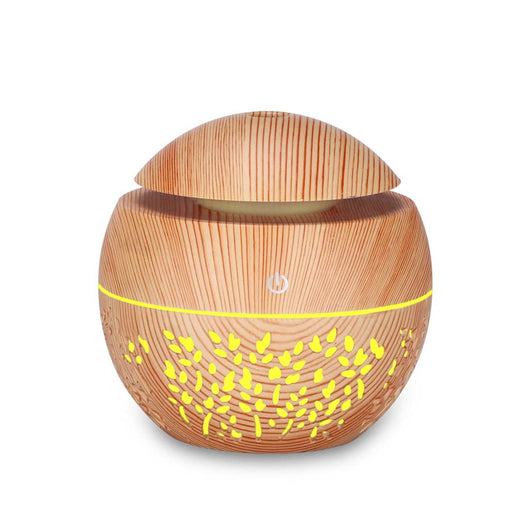 Dark wood grain mini ultrasonic humidifier with a mushroom shape and decorative hollow-out pattern. - Image 7