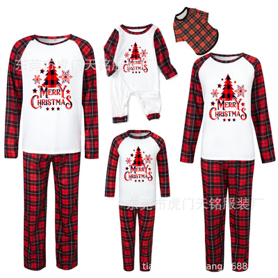 Family of four wearing matching green plaid Christmas pajamas with "Merry Christmas" and Christmas tree print. - Image 14
