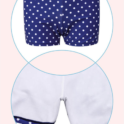 Woman in a cute and sweet three-piece swimsuit with a sheer white polka dot long-sleeve top and navy blue polka dot swim skirt. - Image 10