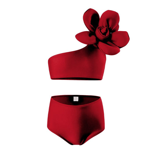 Red children's split swimsuit with a one-shoulder top featuring a large decorative flower and high-waisted bottoms.