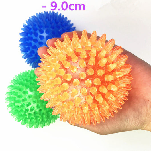 Red spiky TPR ball, a durable and bouncy toy for large dogs, designed for play and massage. - Image 2