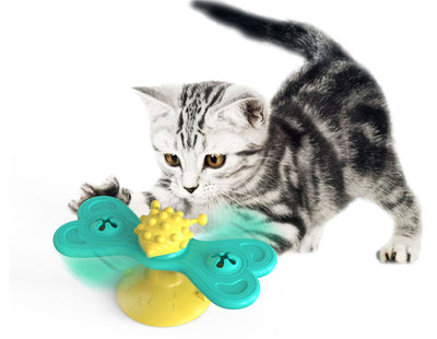 Green and yellow butterfly cat turntable toy with a textured ball, designed as a bite toy for cats. - Image 6