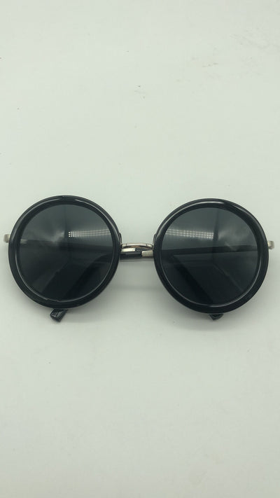Big round sunglasses with black frames and dark lenses, featuring silver-colored temples. - Image 10