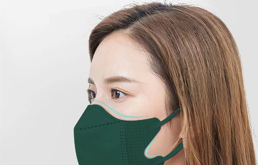 Peach disposable 3-layer face mask with perforated details worn by a person, offering comfortable daily protection. - Image 17