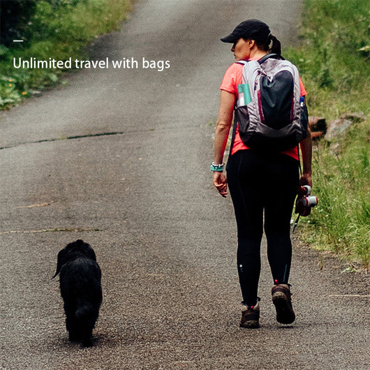 Yellow 450ml portable pet water bottle with a folding drinking trough and white wrist strap, on grass. - Image 13