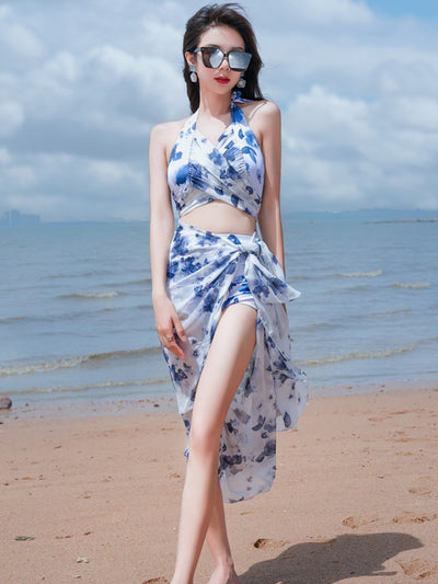 Women's light blue tropical leaf print three-piece swimsuit with short sleeve bikini top, bottoms, and sarong skirt. - Image 32