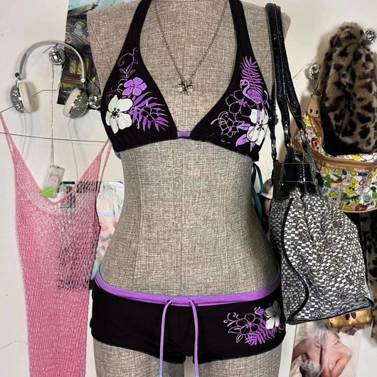 Black halter bikini suit with boy short bottoms, featuring pink and blue floral and flamingo patterns. - Image 9