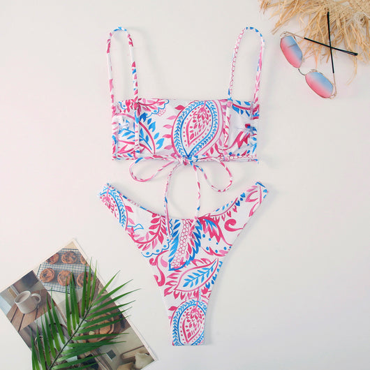 White ribbed two-piece swimsuit with pink and blue paisley floral print, bandeau top, and high-cut bottoms. - Image 11