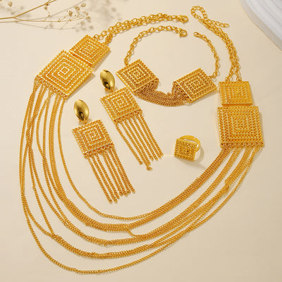 5-piece gold-plated jewelry set with multi-layered tassel necklace, matching dangle earrings, bracelet, and square ring.