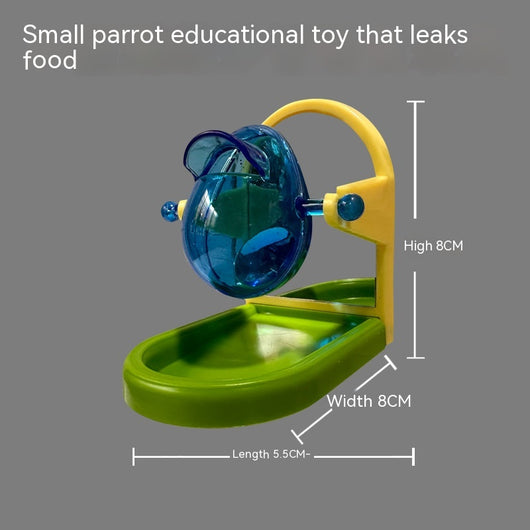 Small blue, yellow, and green parrot food leakage toy with a rotating dispenser and catch tray. - Image 3