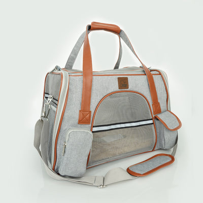 Light grey pet carrier with brown faux leather trim, mesh windows, top handles, and an adjustable shoulder strap. - Image 9