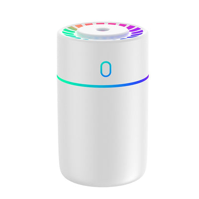 Pink cylindrical humidifier with a colorful LED light ring on top and a blue-green light band around its middle. - Image 4