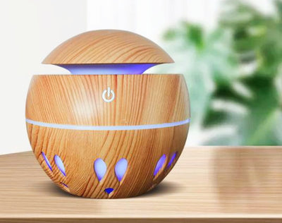 Dark wood grain aroma diffuser and humidifier with a silver power button and accent line. - Image 5