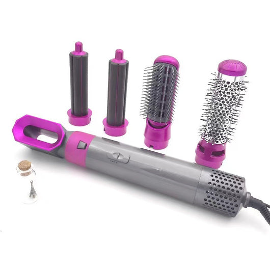 5-in-1 hot air comb hair dryer set with multiple rose red and gray attachments in a white tray. - Image 17