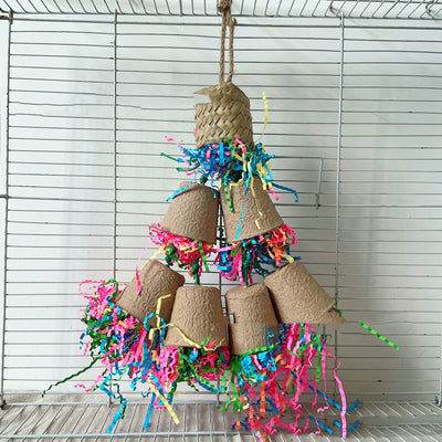 Parrot gnawing toy with brown paper cups, a woven palm top, and colorful shredded paper hanging in a bird cage. - Image 6