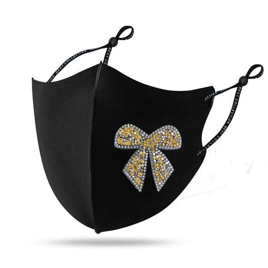 Black cloth face mask with a sparkling red and silver rhinestone bow design and adjustable ear loops. - Image 8
