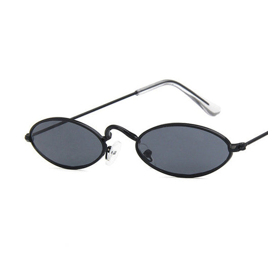 Retro oval frame sunglasses with vibrant red lenses and shiny gold-colored metal frames on a white background. - Image 16