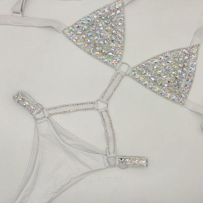 White rhinestone bikini with triangle tops, high-cut bottoms, and silver-toned O-rings and chains. - Image 7
