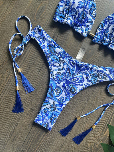 Women's blue and white porcelain print halter bikini with tie-side bottoms and blue tassels. - Image 13