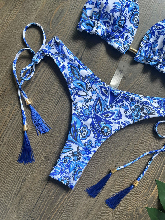 Women's blue and white porcelain print halter bikini with tie-side bottoms and blue tassels. - Image 13