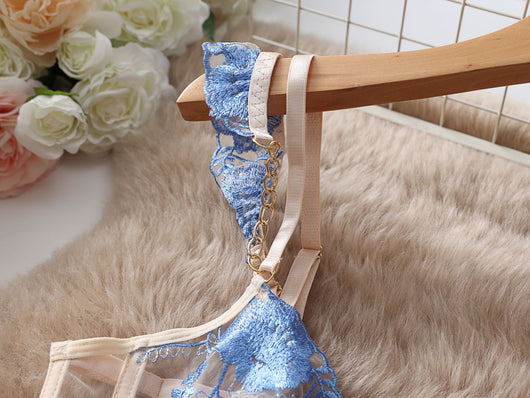 Light blue and beige embroidered sheer push-up bra set with floral lace, matching thong, garter straps, and mini skirt. - Image 8