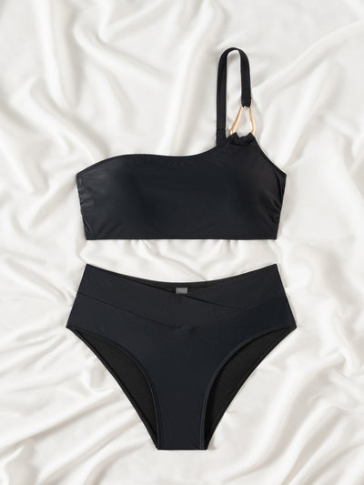 Black one-shoulder bikini with a gold-tone metal buckle detail and high-waisted bottoms with a V-front design. - Image 13