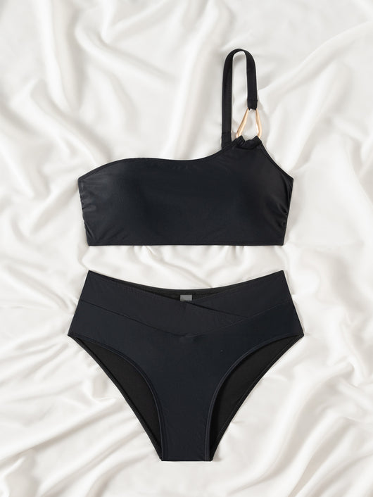 Black one-shoulder bikini with a gold-tone metal buckle detail and high-waisted bottoms with a V-front design. - Image 13