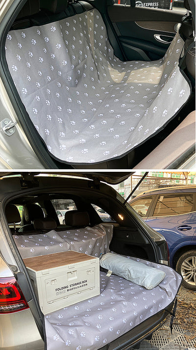 Pink car pet mat with white paw print and bone patterns, featuring black straps for securing to a rear seat. - Image 23
