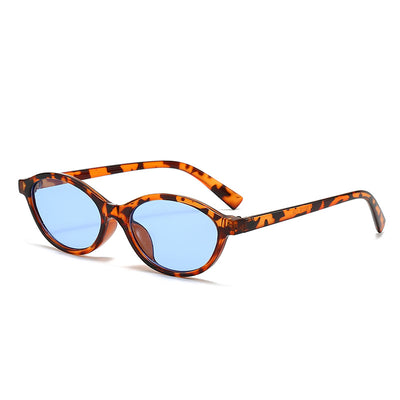 Retro fashion small frame sunglasses with translucent brown frames and yellow oval lenses, viewed from an angle. - Image 3