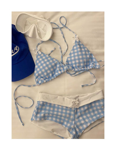 Light blue and white gingham bikini set with a triangle halter top and low-rise boy short bottoms with a small bow. - Image 13