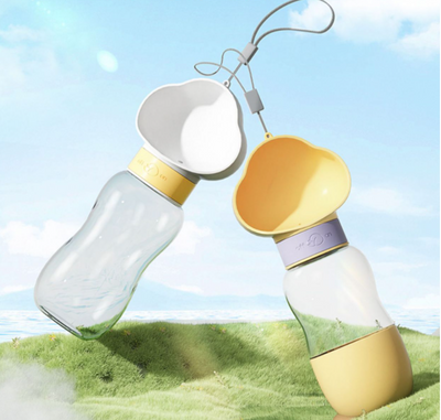 Yellow and clear portable pet water bottle with integrated drinking bowl and separate food container for walking dogs. - Image 21