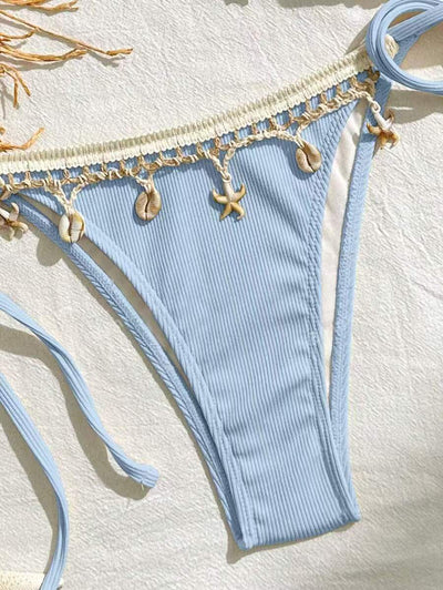 Light pink ribbed halterneck bikini with triangle cups and tie-side bottom, adorned with shell and starfish charms. - Image 15